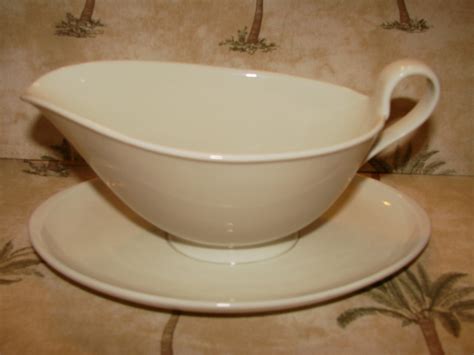 This 2-piece set includes 16 ounce gravy boat and saucer. This uniquely-shaped all-white design adds a touch of elegance to a traditional setting. This collection set perfectly with both formal and casual stemware and flatware as well as our own Antique Orchard pattern. Crafted quality porcelain pattern is dishwasher safe, microwave safe and .... 