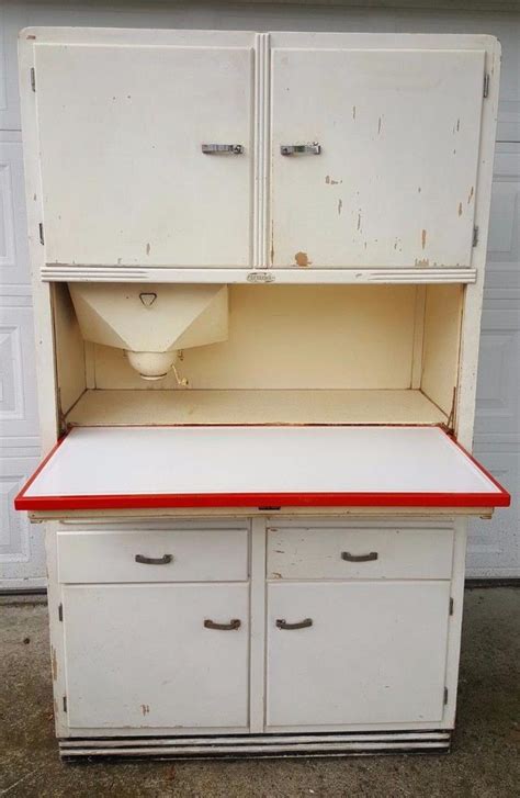 Oct 7, 2023 · Key Takeaways You’ll see some extra features like labeled racks, flour bins, and iron boards with an old Hoosier cabinet. Vintage Hoosier cabinets with Wood, Porcelain-coated, or Glass shutters fetch the best returns. You can check your cabinet’s age by its series number or brand logo. . 