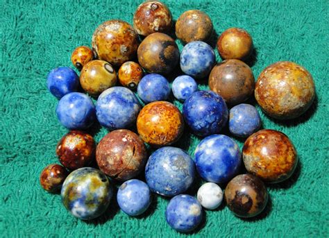 Antique marbles. We wanted marbles that we had as children like Bumble-Bees, Cubscouts, Puries, and so on. In 1997 this "need" led us to the opening of the Moon Marble Company store. The store is located near the intersection of K-32 & Hwy 7 in Bonner Springs, KS. We stock machine made marbles in a multitude of colors and designs in sizes from pee-wees to 50mm. 
