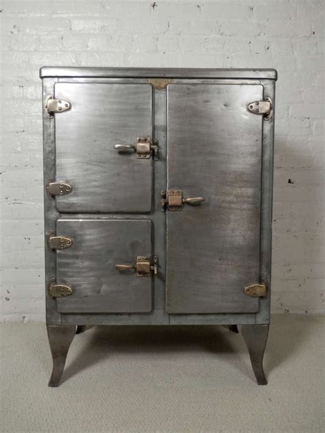 Antique metal ice box value. Our Portland Ice Box Wood Jelly Cabinet with Replica Hardware makes a gorgeous storage solution anywhere in the home. This sturdy wood cabinet resembles an antique jelly cabinet with vintage-style hardware and a distressed finish adding to the authentic design. Two doors reveal ample storage shelves. 