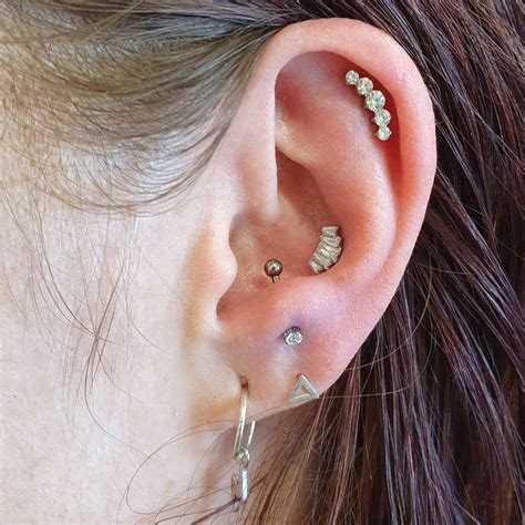 Antitragus piercings. Sep 19, 2019 · As with most piercings, whether you should get one or not depends on the anatomy of your ear. Some ears have enough cartilage to hold a piercing, whereas others don’t have the space. Also consider the healing time, which is about six to eight months for this one. Still—you can’t deny how pretty and unique the anti-tragus piercing looks. 