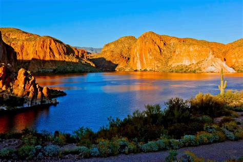 Originally built as a copper trade route, the Apache Trail now guides travelers past steep desert mountains, cliff dwellings, lake shores, eroded canyons, ....