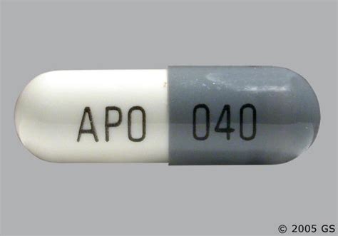 Pill Imprint APO ATV40. This white elliptical / oval pill wi