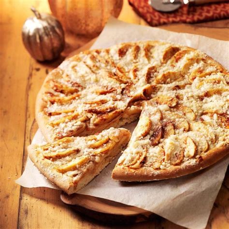 Apple pizza. Sep 13, 2023 · Directions. Pat cookie dough onto a 7-1/2-in. pizza pan coated with cooking spray. Bake at 350° for 12-14 minutes or until lightly browned. Cool. In a small bowl, beat the cream cheese, brown sugar, peanut butter and vanilla. Spread over crust. Arrange apple slices on top. Sprinkle with peanuts and cinnamon; drizzle with caramel topping. 