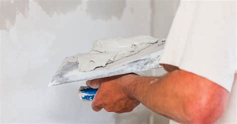 Applying skim coat plaster.  Step-by-Step Guide to Applying Skim Coat Over Ol...