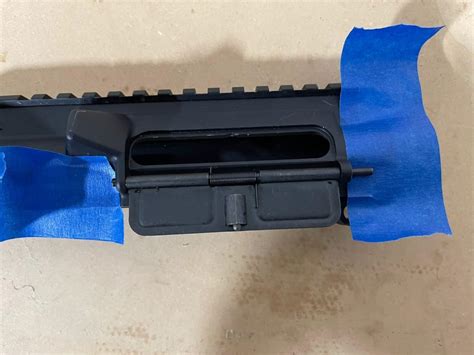 Engraved AR-15 ejection port dust covers are a great way to custo