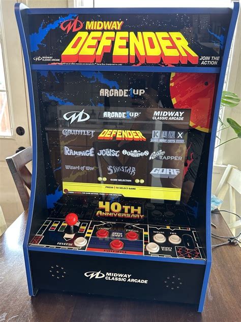 Designed to be mounted on a wall, door, or sitting on a table, this sweet setup features eight classic games and comes complete with original artwork and coinless operation (every kid's dream!), adding the ultimate cool factor to your finished basement, man cave, home office or dining room (we won't judge) Games Included: Defender Joust Rampage .... 