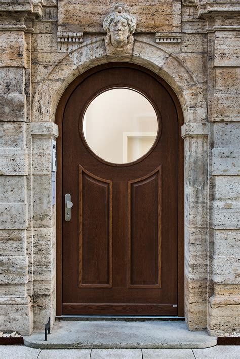 Arch door. Feather River Doors. 67.5 in.x81.625 in. Medina Zinc Center Arch Lt Stained Medium Oak Right-Hand Fiberglass Prehung Front Door w/Sidelites 