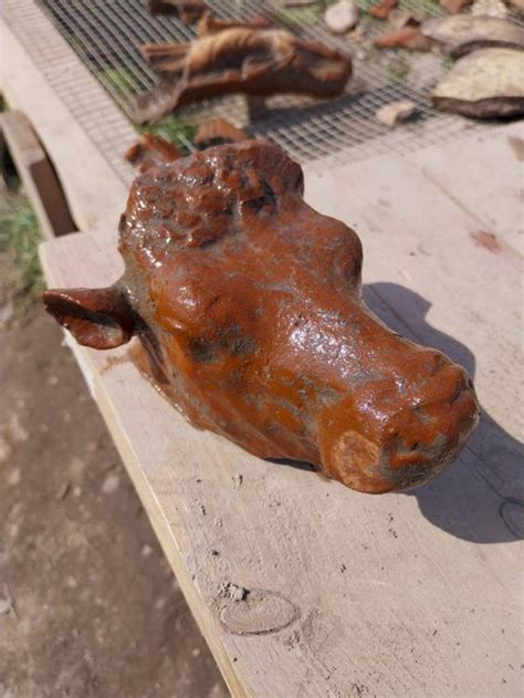 Archeologists in Italy unearth ancient dolphin statuette