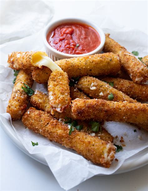 Are mozzarella sticks healthy. Instructions. Fill a tall-sided heavy skillet with a couple of inches of oil and heat to 365 degrees. Whisk together milk and egg in a bowl. Add breadcrumbs to a separate bowl. Dip mozzarella string cheese in the beaten eggs, then breadcrumbs, then add a second coating by dipping the cheese sticks in the egg … 