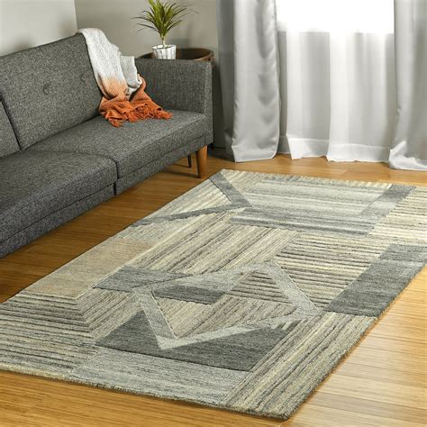 Area rug wool. Bring classic style to your bedroom, living room, or home office with a richly-dimensional handmade light gold area rug. Artfully hand-tufted, these plush wool area rugs are crafted with plush and loop textures to highlight timeless motifs updated for today's homes in fashion colors. Pile Height: 0.63'' Construction Method: Handmade; Material: Wool 
