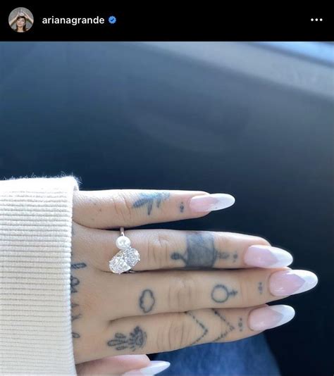 Ariana Grande’s finger tattoos look like they were done with a ...