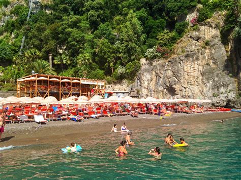 Arienzo beach club. Arienzo Beach Club is on an exclusive beach accessible primarily by boat transfer provided by the club from Positano. It neighbours a gorgeous waterfront 5* hotel. The scenery is stunning from sheer cliffs to clear aqua water and volcanic pebbles. The club offers package bookings at various price points which make the day effortless as ... 