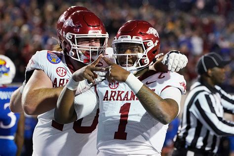 Official:: Arkansas to play Kansas in Liberty Bowl. The Razorbacks will play in their sixth AutoZone Liberty Bowl in Memphis, Tennessee on Dec. 28 (4:30 p.m. CT, ESPN). Kansas is the opponent out of the Big 12. Arkansas (6-6) has played Kansas (6-6) just twice, the last time being in 1906. The Jayhawks have won both matchups.. 