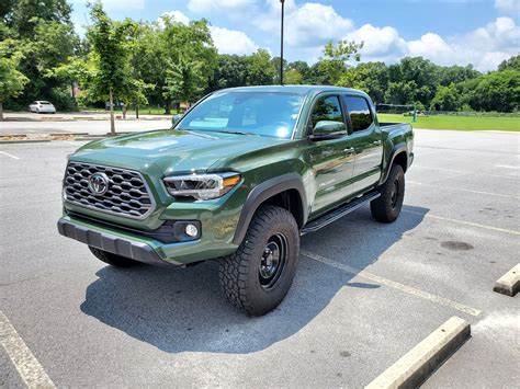 12 years in the making... 2021 Army Green Tacoma SR5 Trail Edition... Just about the perfect truck for me! ... but I'm obsessed with how good bronze wheels look with the Army Green, so while I keep saving to get new/better wheels, I might try PlastiDipping or straight-up spray painting them bronze... Weekend project with my 8-yo boy coming up!. 
