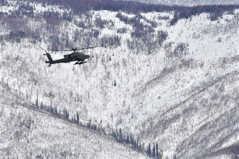 Army helicopter flying through Alaska mountain pass hit another in fatal April crash, report says