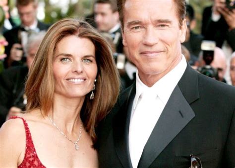 Arnold Schwarzenegger kisses his wife, Maria Sh