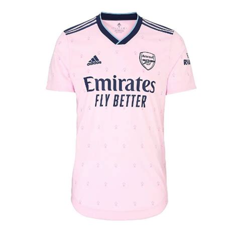 Arsenal pink jersey. The Kids Arsenal 22/23 third kit is mainly a light shade of pink. It is the first-ever pink shirt in the history of the North London club. Officially, the main colour is “Clear Pink”. Clear Pink is the same colour used by Adidas for Inter Miami in their inaugural season. 