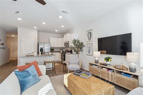 At Artisan Living Grand Lagoon, you’ll find thoughtfully crafted two and three-bedroom townhomes that make coming home the best part of your day. Step inside your new home to find stainless steel appliances, wood-inspired flooring, and spacious walk-in closets.. 