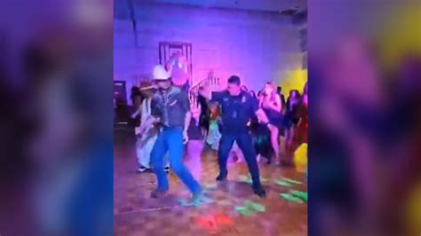 Arvada Police SRO busts a move at senior prom