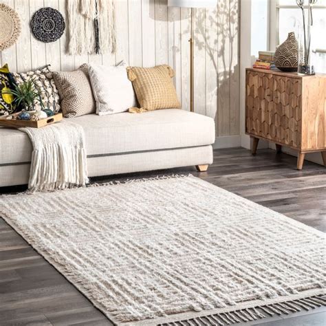 Talk about versatility! With calming hues and a cool crosshatch pattern, the Chrissy Rug is oh-so-chic. Featuring a super unique, shaggy texture, it’s an essential piece in the Arvin Olano x Rugs USA collection. It serves up a just-right mix of neutral and super stylish that's a stunning reflection of the designer's personal style. Jute-like edges give it an easy, …