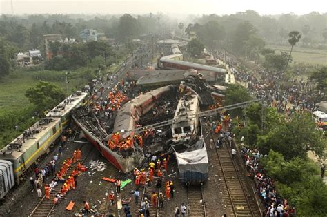 As India grieves train crash that killed 275, relatives try to identify bodies of loved ones