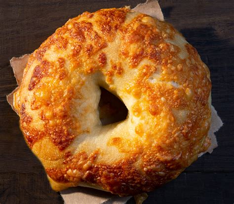 Asiago cheese bagel. 10 ounces freshly grated Asiago cheese. Make the recipe as instructed all the way until the water bath. Place the cheese in a shallow bowl. As the bagels come out of the water bath, immediately place them, one at a time, in the cheese. Turn to coat and press to adhere. Transfer back to the prepared baking sheet. 