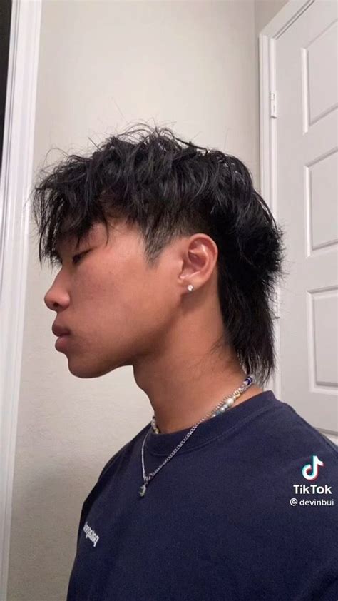 2. Big Bang G-Dragon Inspired Mullet. This one evokes memories of an 80’s hair metal band. Big Bang’s G-Dragon has taken that style and made it his own. Start by growing out your hair to medium length, keeping the top longer than the sides and back. Next, trim the sides short, while leaving the top untouched.