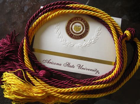 Honors designated on your diploma will reflect your final cumulative ASU GPA. Pick up honor cords at any University Registrar Services location. ASU Online Students will receive an email with additional information about honor cords and ceremonies. Celebrate your achievement .