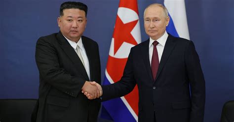 At global pariah summit, Putin and Kim Jong Un talk weapons and satellite tech