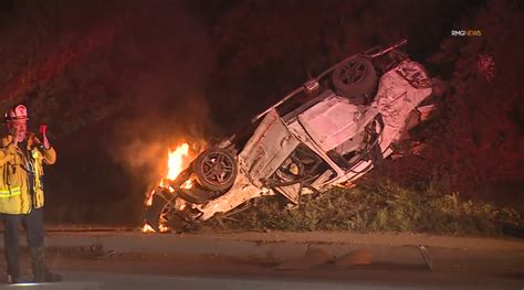 At least 1 man hospitalized after car flies off freeway off-ramp 