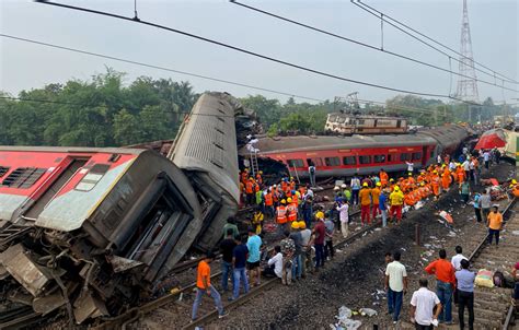 At least 14 killed and many injured when one train hits another in central Bangladesh