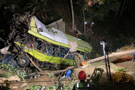 At least 16 dead and 12 injured as passenger bus falls off ravine in central Philippines