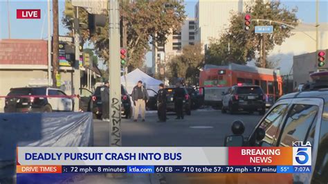 At least 2 dead after minivan involved in pursuit slams into bus  