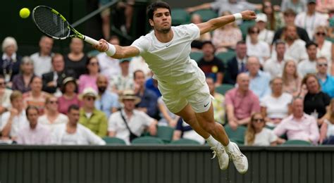 At rainy Wimbledon, Alcaraz among those playing day after day — and winning