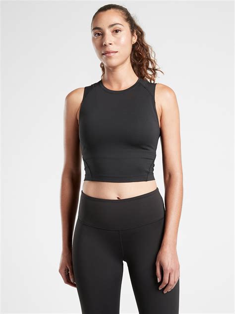Machine wash and dry. Imported. Fit + Sizing. Fitted close to the skin. Deep plunging neckline. Body length in size medium: Regular: 16&#34 Body length in size Plus/2X: Regular: 17&#34. Shop Athleta's Aurora Seamless Crop Rib Tank: FOR: Yoga or studio practice, FEEL: Chafe&#45free seamless fabric stretches with every move, FAVE: Rib …. 