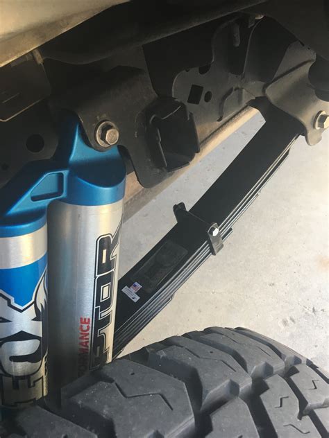 They are longer than the original front leaf springs. You must use a 