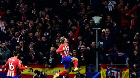 Atletico beats Lazio in its 20th straight home win to secure 1st place in Champions League group