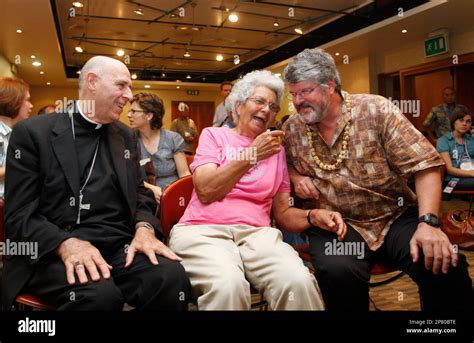 Audrey Toguchi, a 80-year-old Hawaiian, center left, walks during a ...