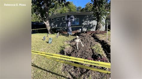 Austin family waiting for City inspection turns trench into Halloween display
