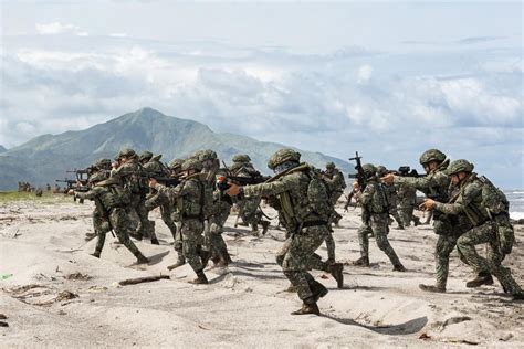 Australian, US, Filipino forces practice retaking an island in a drill along the South China Sea