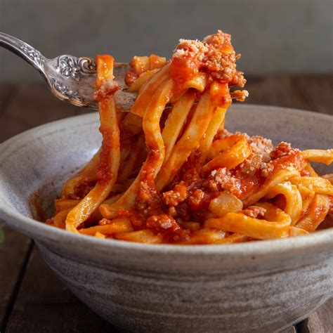 Authentic bolognese recipe. Pour the tomatoes into a bowl and squish them with your hands to break them up so there are no large pieces. Add them to the skillet and bring the sauce to a simmer. Turn the heat to low and simmer the sauce for 15 to 20 minutes, stirring occasionally, until the sauce is thick. If the sauce begins to look dry, stir in 1 to 2 tablespoons hot water. 