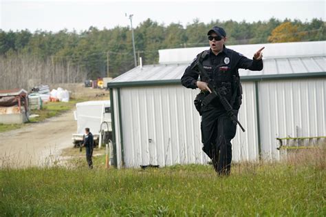 Authorities scour woods, water and homes searching for suspect in Maine mass shooting