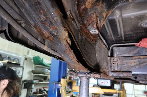 Repairing a subframe by cutting out the rust, welding patches, then painting.Although this subframe is from a Saturn S-Series car this information is univera.... 