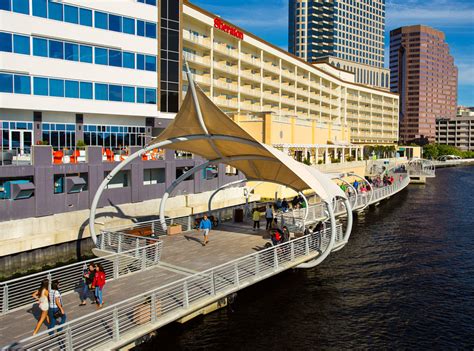 Ave tampa riverwalk. How to Get to Sparkman Wharf from AVE Tampa Riverwalk Getting to Sparkman Wharf from AVE Tampa Riverwalk is a breeze. It’s a 6-minute drive by car, but walking and taking advantage of Tampa's free streetcar is way more fun. Enjoy a scenic 15-minute walk to Downtown Tampa Station, followed by a short three-stop ride to Amalie Arena Station on ... 