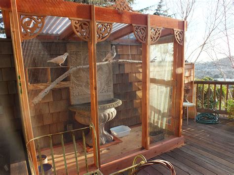 Aviary for sale. Optional mesh and timber fully enclosed run with safety door for peace of mind. Walk-in, easy-care small bird aviary. Perfect for budgies, canaries, finches, cockatiels and love birds. Aviary dimensions: 2.4m long x 1.2m deep x 1.8m high to the front. Optional security door: 0.9m wide x 1.2m deep. 