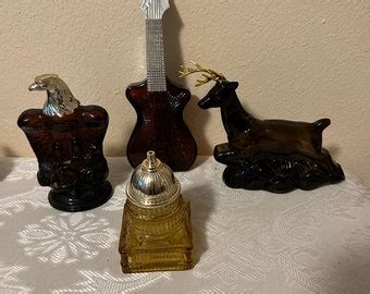 Avon cologne bottles. .  #VintagePerfume #AVON #ToAWildRose #Cologne #Decanter #WomensCologne #...