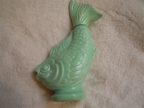 This collectible Avon bottle features a fun and unique design of a fish. The brand is well-known for producing high-quality and collectible items, making this a great addition to any collection. The bottle is made with durable materials and is perfect for displaying on a shelf or using as a decorative piece.