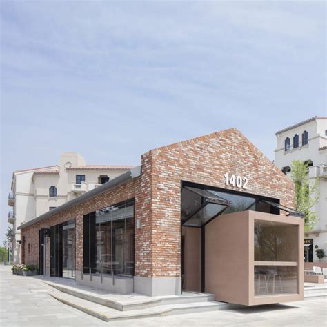 BLUE Architecture adds rectangular cafe to red brick building in China