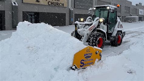 BOBCAT L85 PLOWING SNOW WITH 13’ ARCTIC SECTIONAL …